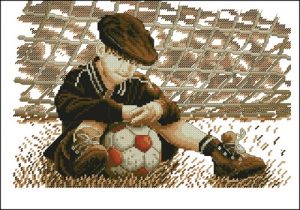 Boy Resting with Soccer Ball Boy Resting with Soccer Ball