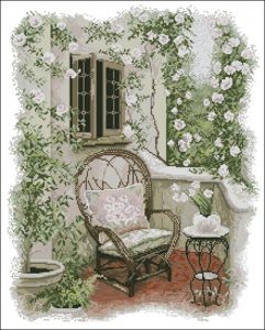 Wicker Chair Among Roses